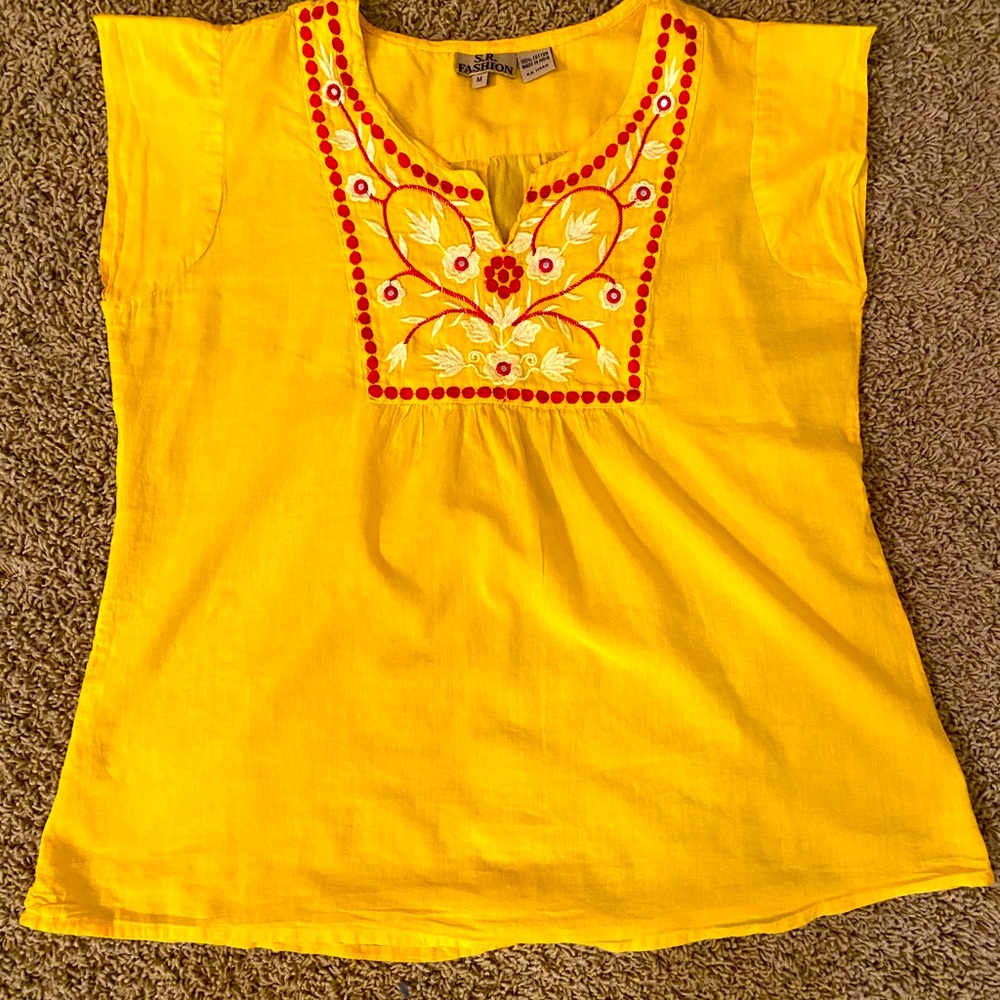 Super cute yellow top with red & cream colored embroidery. Wore once!